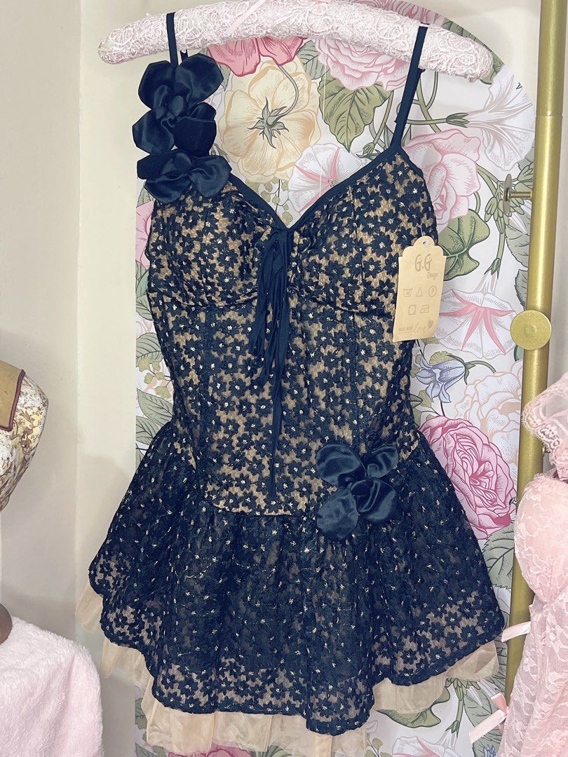 For rent mini black dress (Category: Dresses) located in Cavite. Submitted by wishie_collects (Listing ID 1459829531, Image 3). Description: Design: A black and nude floral lace mini dress featuring a sweetheart neckline, thin straps, and an asymmetrical floral accent on the shoulder. Skirt: A flared, ruffled skirt layered over a contrasting nude sheer mesh or tulle petticoat. Size Small to Semi Med Will include accessories of your choice.