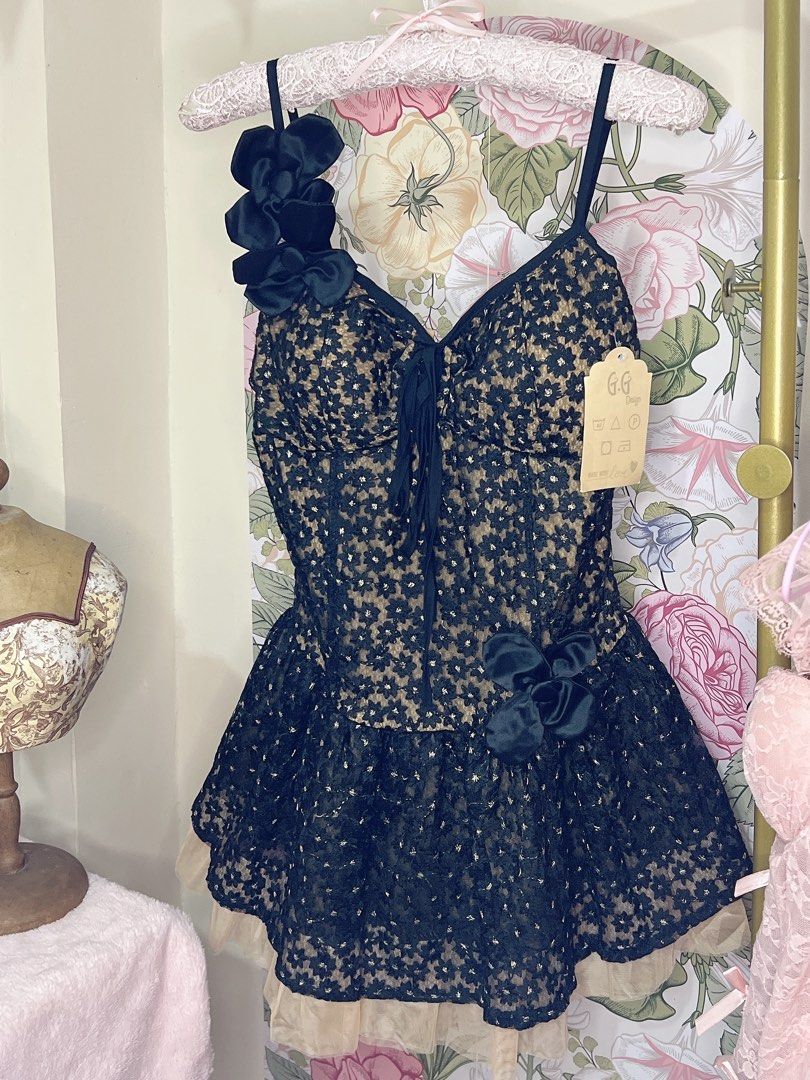 For rent mini black dress (Category: Dresses) located in Cavite. Submitted by wishie_collects (Listing ID 1459829531, Image 2). Description: Design: A black and nude floral lace mini dress featuring a sweetheart neckline, thin straps, and an asymmetrical floral accent on the shoulder. Skirt: A flared, ruffled skirt layered over a contrasting nude sheer mesh or tulle petticoat. Size Small to Semi Med Will include accessories of your choice.
