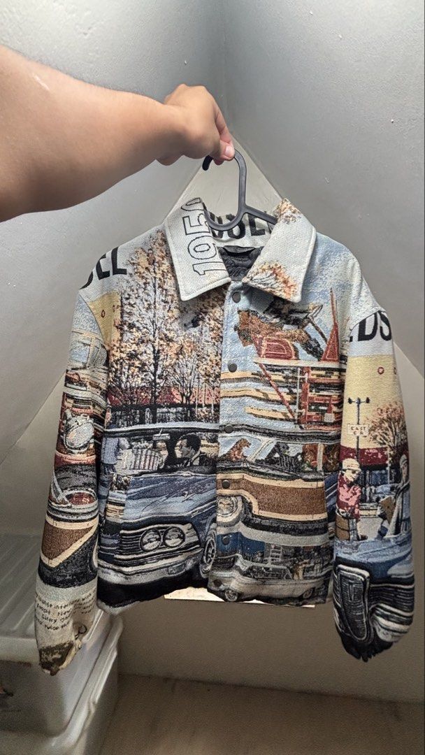 FORD © JACQUARD QUILTED JACKET (Category: Coats, Jackets and Outerwear) located in Pasay City. Submitted by gabesboutique (Listing ID 1459778438, Image 1). Description: - Unique tapestry jacket with vintage car and street scene print. - Features a classic collar and button-up front. - Ideal for layering over tees or hoodies. - Stand-out design for casual wear..