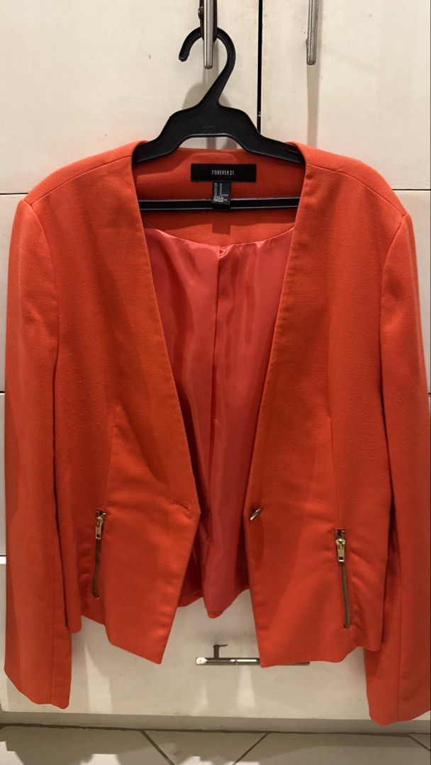 Forever 21 Orange Cropped Blazer Size M (Category: Coats, Jackets and Outerwear) located in Taytay. Submitted by kukivane (Listing ID 1459811884, Image 2). Description: - Orange cropped blazer from Forever 21 - Single button closure - Zip details on pockets - Gold button and zip accents - Versatile for dressing up or down - Size M.