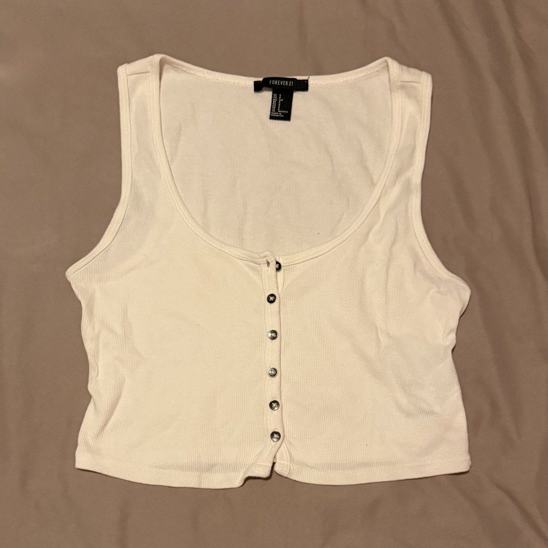 Forever 21 White Ribbed Button-Up Cropped Tank Top (Category: Sleeveless) located in Manila. Submitted by gabskkasells (Listing ID 1459848410, Image 1). Description: Not using this na! RFS: Decluttering.