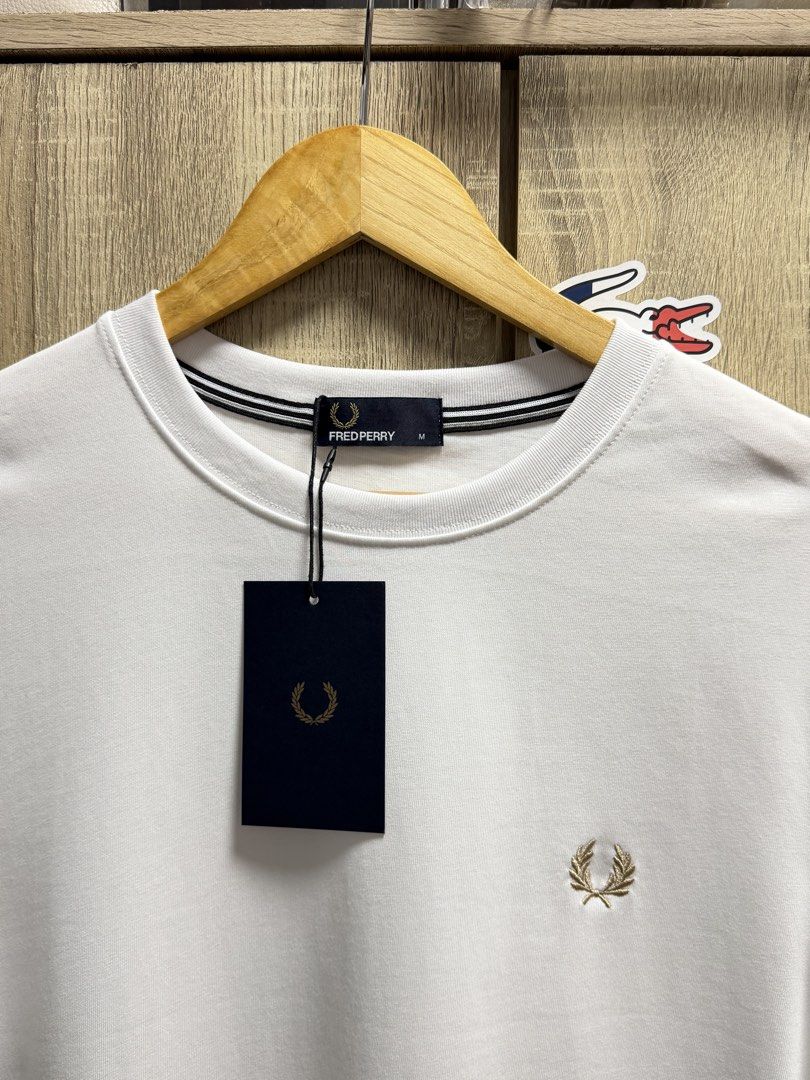 Fred Perry Crewneck Tshirt (Category: Tshirts & Polo Shirts ) located in Cavite. Submitted by PRIVATE.Selection (Listing ID 1459879941, Image 3). Description: Fred Perry Crewneck Tshirt Size Medium W 20 L 28 Brand New w Hangtags.