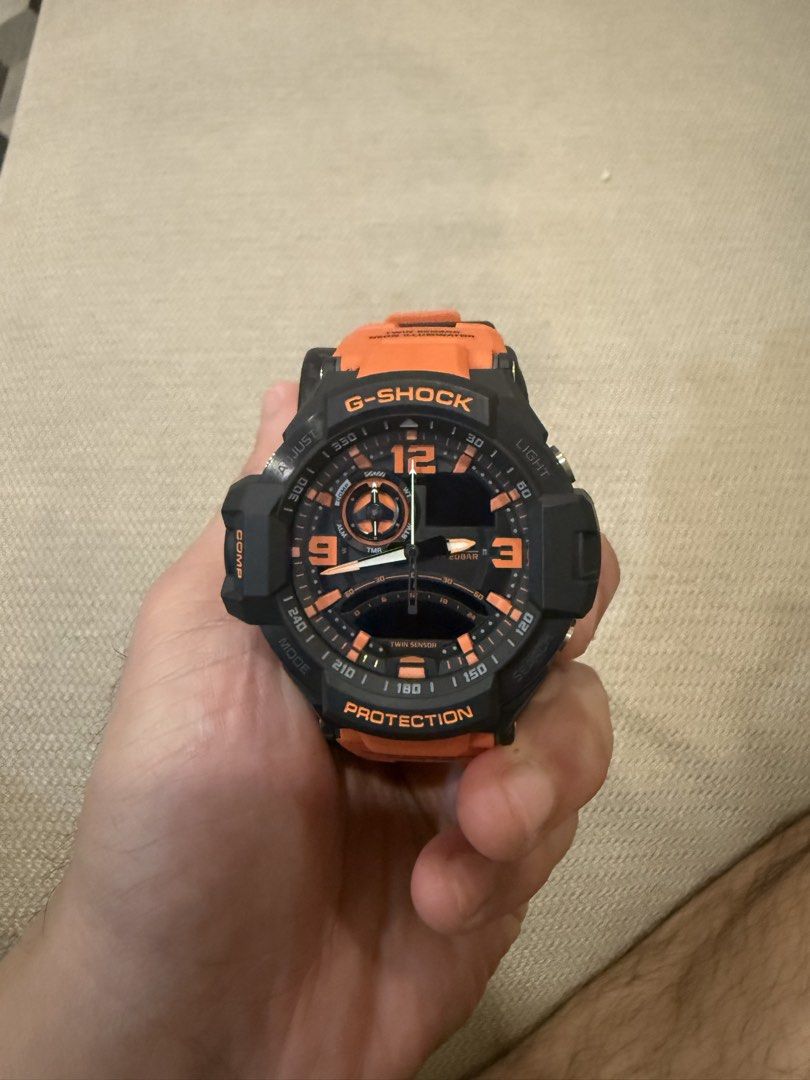 G Shock Gravity Master GA-1000 (Category: Men's Watches) located in Quezon City. Submitted by makatidecluttering (Listing ID 1459835126, Image 1). Description: Rugged aviation-inspired analog-digital G-Shock featuring a high-visibility orange strap and black case. Equipped with Twin Sensor technology (digital compass and thermometer), World Time, 200m water resistance, and UV LED Neon Illuminator backlighting. Never worn, but needs new battery. P