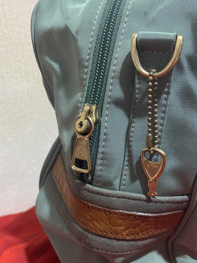 GD Daffle Bag Light Blue Nylon Leather Trim (Category: Tote Bags) located in Manila. Submitted by cdb_22 (Listing ID 1459818399, Image 2). Description: - Chic light blue tote bag with elegant leather trim. - Secure main zip compartment and a convenient back zip pocket. - Features a stylish gold-tone logo emblem on the front flap. - Comfortable leather handles for easy carrying. - Includes a detachable strap for versatile wear. - Ideal for everyda