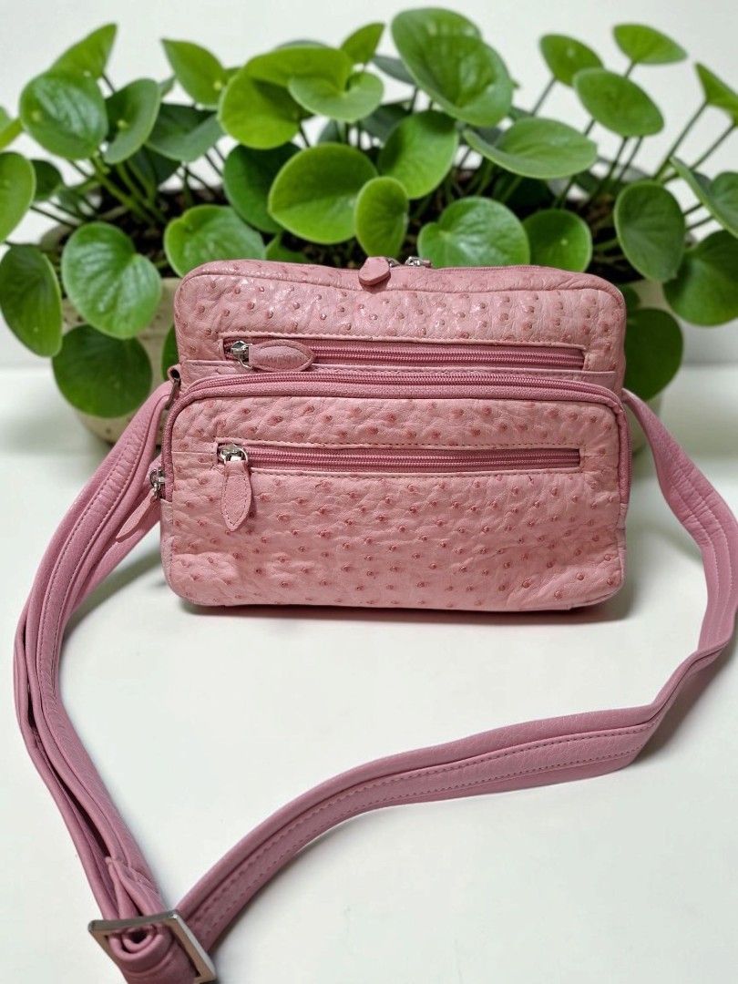 GENUINE OSTRICH LEATHER CAMERA SLING BAG (Category: Cross-body Bags) located in Las Pinas. Submitted by annachiaonair2037 (Listing ID 1459762851, Image 2). Description: 1280 EACH brown ❌️❌️SOLD PINK ❤️ AVAILABLE BUNDLE PRICE AVAILABLE AVAILABLE IN PINK & BROWN FROM JAPAN INNER SUEDE LINING H 7" L 11" W 4.5" RARE FINDS SPACIOUS AND ROOMY.