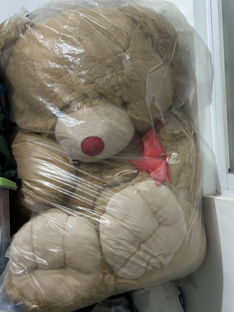 Giant Brown Teddy Bear Plush Toy (Category: Plushies & Soft Toys) located in Batangas. Submitted by enyahsnivl56498 (Listing ID 1459806930, Image 1). Description: - Super big teddy bear - Perfect for hugs or room decoration - Adorable red nose and red ribbon - Soft and fluffy fur - Still in original plastic packaging - Ideal gift for someone special.