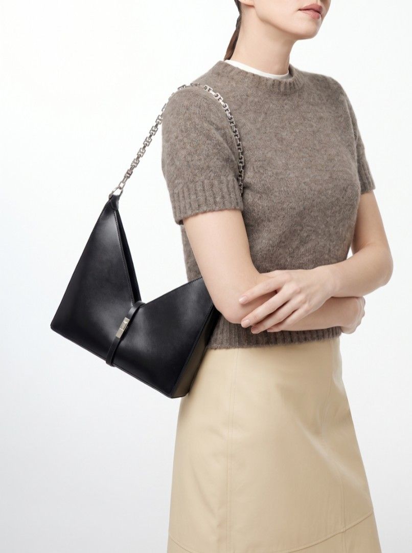 Givenchy cut out leather shoulder bag (Category: Luxury Bags & Wallets) located in Bagabag. Submitted by thrift_stories96 (Listing ID 1459855127, Image 1). Description: Givenchy cut out leather shoulder bag Medium size Measurements Height - 11 Width - 10.5 Condition - Rank AB Flaw - pressmark Normal sign of use ,needs cleaning only..