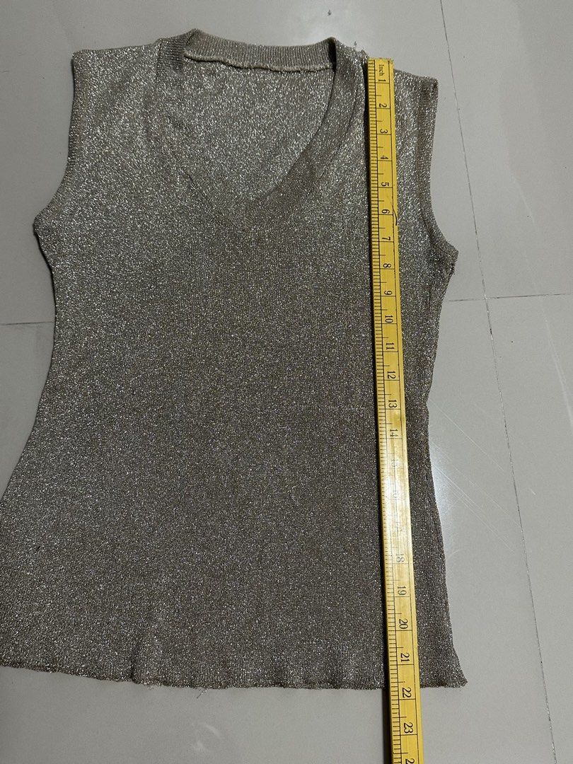 Gold Sleeveless Vneck Top (Category: Others Tops) located in Manila. Submitted by mae__________c (Listing ID 1459787576, Image 2). Description: Stretchable no issue decluttering Small to medium sta ana manila.