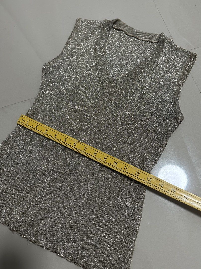 Gold Sleeveless Vneck Top (Category: Others Tops) located in Manila. Submitted by mae__________c (Listing ID 1459787576, Image 3). Description: Stretchable no issue decluttering Small to medium sta ana manila.
