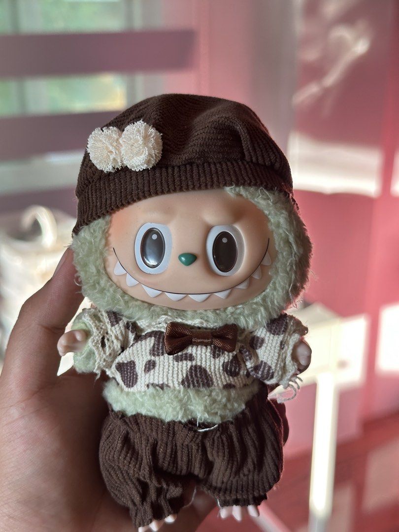 Green Labubu with Brown Outfit (Category: Designer & Blind Box Toys) located in Bacacay. Submitted by kirakiiraa (Listing ID 1459693298, Image 1). Description: - Ready for a new home! - No box and card but AUTHENTIC.