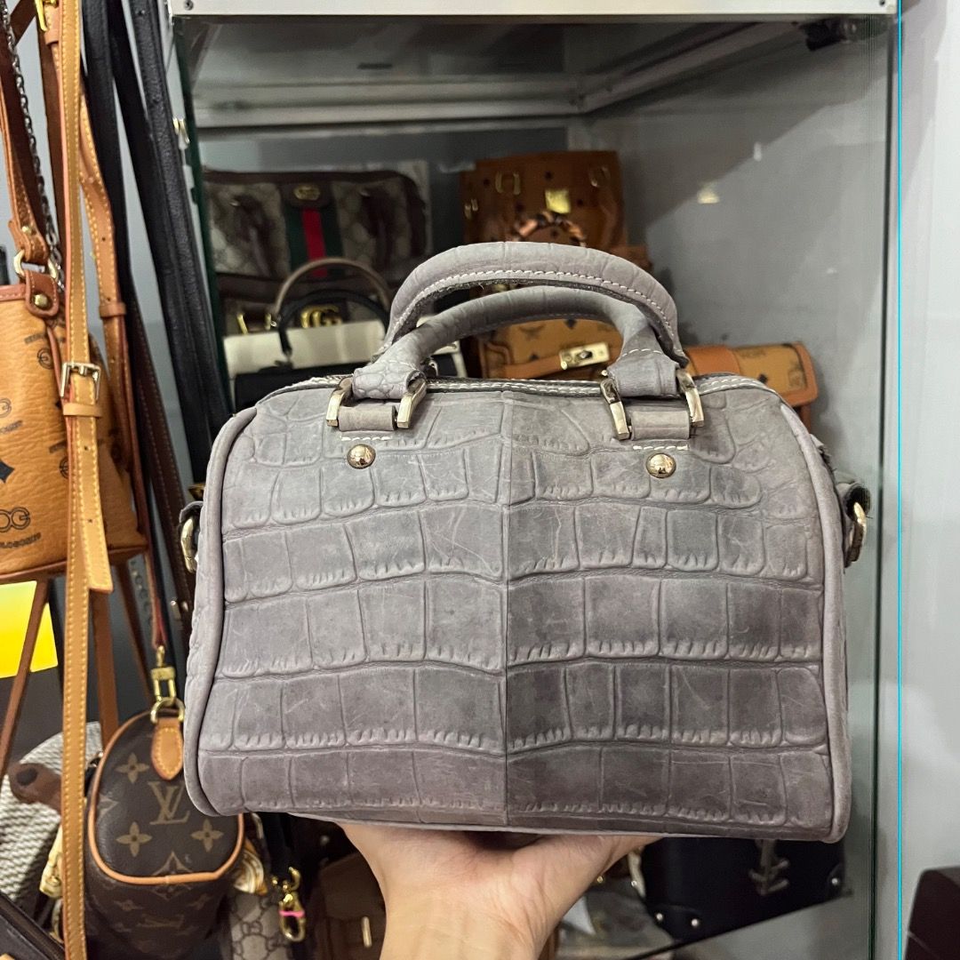Grey Crocodile Embossed Leather Top Handle Bag with Strap (Category: Luxury Bags & Wallets) located in Cagayan de Oro. Submitted by kathkoleksyon (Listing ID 1459898639, Image 1). Description: - Stylish grey leather handbag - Elegant crocodile embossed texture - Comfortable top handles - Detachable shoulder strap for versatility - Chic gold-tone hardware - Secure zipper closure - Interior lined with vibrant blue fabric - Ideal for everyday or spe