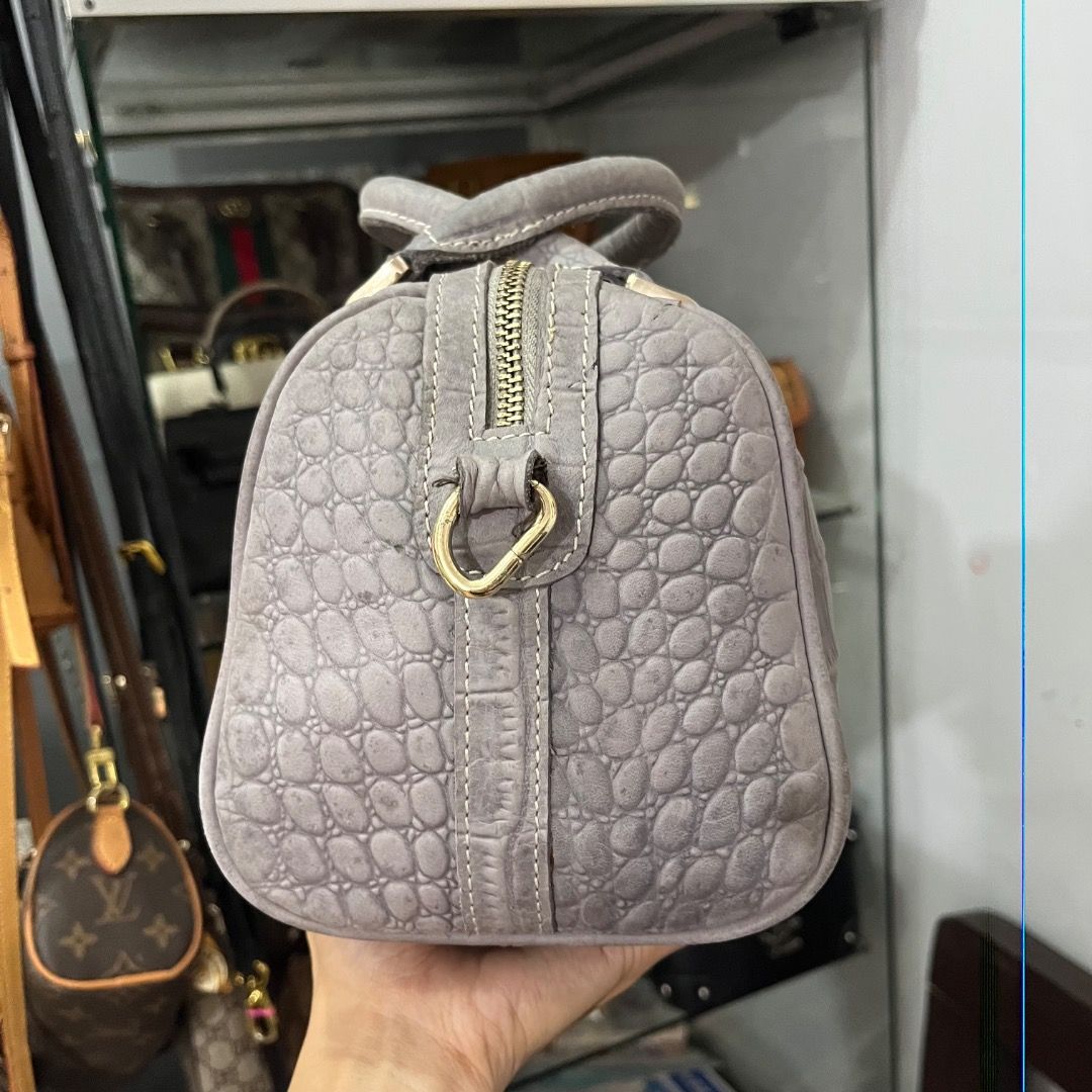 Grey Crocodile Embossed Leather Top Handle Bag with Strap (Category: Luxury Bags & Wallets) located in Cagayan de Oro. Submitted by kathkoleksyon (Listing ID 1459898639, Image 2). Description: - Stylish grey leather handbag - Elegant crocodile embossed texture - Comfortable top handles - Detachable shoulder strap for versatility - Chic gold-tone hardware - Secure zipper closure - Interior lined with vibrant blue fabric - Ideal for everyday or spe