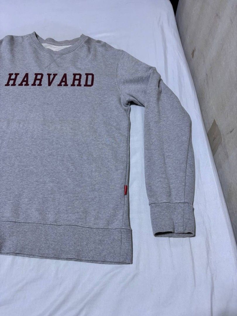 Grey Harvard University Crewneck Sweatshirt (Category: Coats, Jackets and Outerwear) located in Pasig City. Submitted by heneralsupremo1892 (Listing ID 1459694638, Image 2). Description: - Grey sweatshirt with 'HARVARD' in maroon print - Classic crewneck design - Ribbed cuffs and hem for a snug fit - Comfortable and casual, ideal for everyday wear - Features a small red tag on the side - Authentic and Legit❗ - Very Good Condition/ Almost New 🔥 -