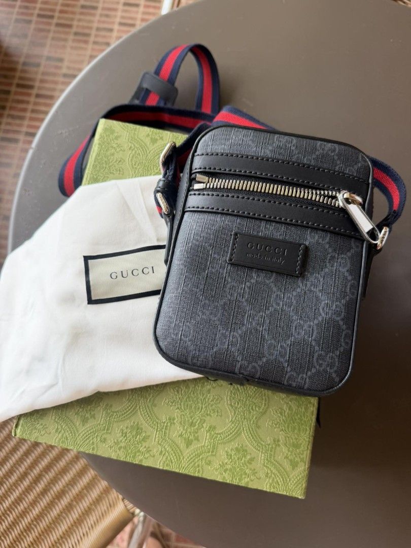 Gucci GG Monogram Canvas Crossbody Bag (Category: Luxury Bags & Wallets) located in Manila. Submitted by mertix48319 (Listing ID 1459757793, Image 1). Description: - Authentic Gucci crossbody bag - Classic GG monogram pattern (black/grey) - Genuine leather trim and strap - Secure zip closure - Comes with original dust bag and box - Ideal for everyday wear -Like new.