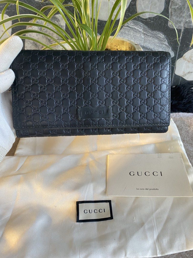 Gucci Monogram Leather Long Wallet (Category: Luxury Bags & Wallets) located in Bacolod City. Submitted by chuchaystuffs (Listing ID 1459741143, Image 1). Description: - Authentic Gucci long wallet - Iconic GG monogram embossed on black leather - Ample space for cards and cash - Includes dust bag and authenticity card - Perfect for everyday use .