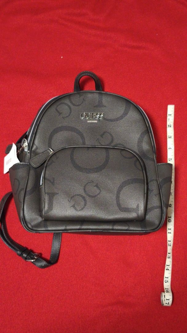 Guess Ryerson Backpack Coal CC731130 (Category: Backpacks) located in Angono. Submitted by declutterstar09 (Listing ID 1459807752, Image 1). Description: - Guess backpack in Coal color - All-over GG pattern - Front zip pocket - Adjustable straps - Perfect size for everyday essentials - Measurements: Height approx 10 inches, Width approx 8 inches, Depth approx 4 inches - Comes with original tags.