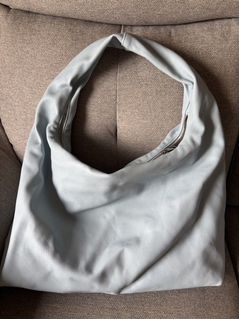 GVN Large Hobo Bag (light blue) (Category: Shoulder Bags) located in San Juan City. Submitted by pinkbelle14 (Listing ID 1459693376, Image 2). Description: - Soft light blue hobo bag - Faux leather material - Zipper closure for security - Spacious interior with an internal zippered pocket - Simple and chic design - Ideal for everyday use.