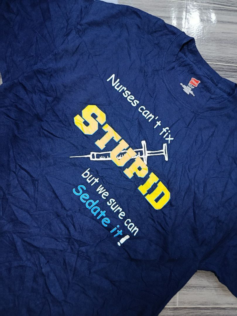 Haness statemenT-shirt "Stupid Nurses Can't Fix" Graphic Tee (Category: Tshirts & Polo Shirts ) located in Bacolod City. Submitted by empatees (Listing ID 1459810355, Image 2). Description: - Navy blue t-shirt - Funny graphic: "Stupid Nurses Can't Fix, but we sure can sedate it!" - Features a syringe graphic - Brand: Haness - Ideal for nurses or those with a sense of humor - Suitable for casual wear.