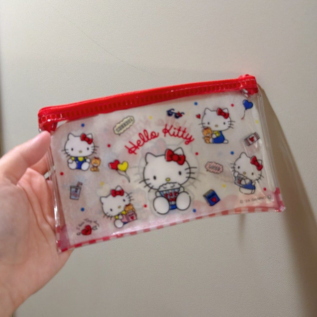 Hello Kitty Clear Pouch Set (M & L) Sanrio (Category: Purses & Pouches) located in Manila. Submitted by wondermoma.ph (Listing ID 1459836806, Image 2). Description: - Adorable Kitty clear pouches - Available in two sizes: M (10x16cm) and L (12x20cm) - Perfect for organizing stationery, makeup, or small essentials - Features cute Kitty graphics - Comes with a stylish red zipper - A must-have for any Sanrio and Kitty enthusiast!.
