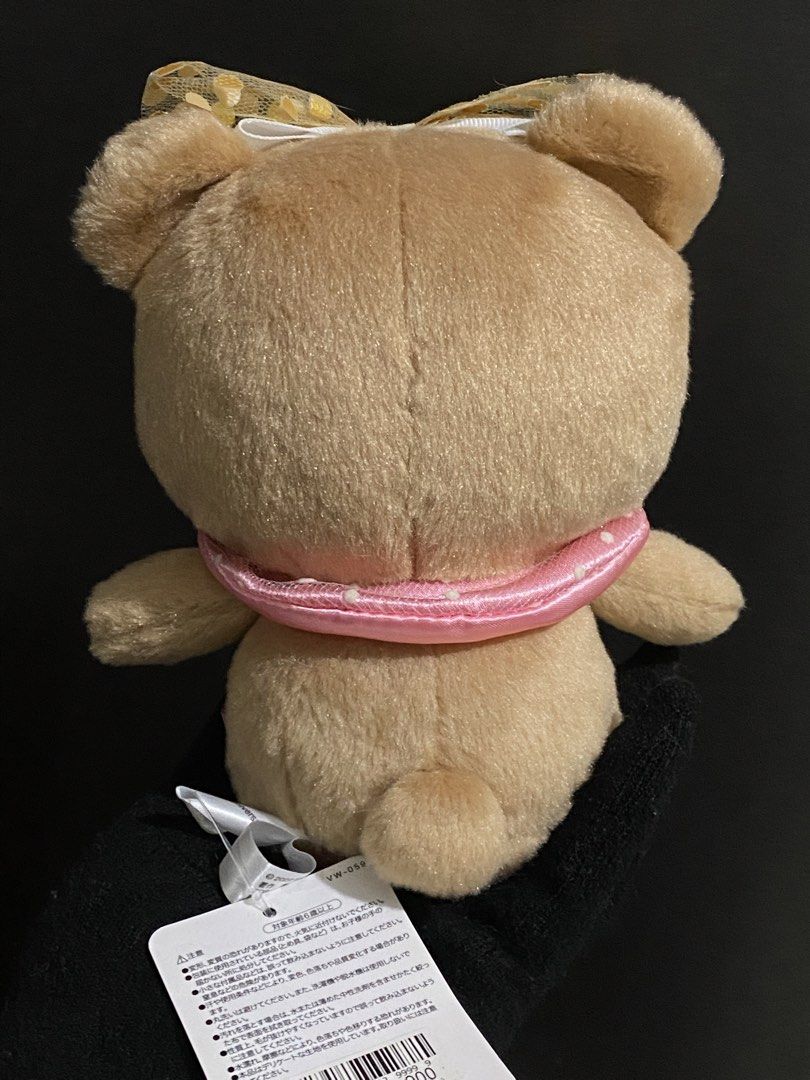 Hello Kitty Universal Studios Japan Teddy Bear Plush (Category: Plushies & Soft Toys) located in Davao. Submitted by hoowans_surplus (Listing ID 1459886900, Image 2). Description: - Super cute teddy bear plush from Universal Studios Japan. - Features a sparkly gold bow. - Adorned with a pink ribbon around its neck. - Original Kitty tag still attached. - Ideal for collectors or as a thoughtful gift. - Exceptionally soft and cuddly material..