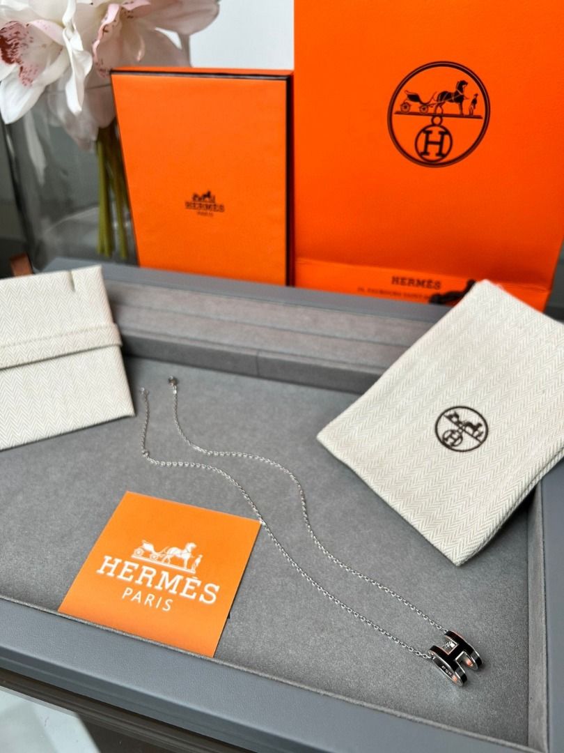 Hermes H Necklace Silver Black (Category: Necklaces) located in San Juan City. Submitted by zenocean-f9dfa7 (Listing ID 1459710090, Image 3). Description: - Authentic outlet Hermes necklace - Iconic 'H' pendant with black enamel - Silver chain - Includes original Hermes box and dust pouch - Versatile for everyday or special occasions - A timeless Hermes classic.