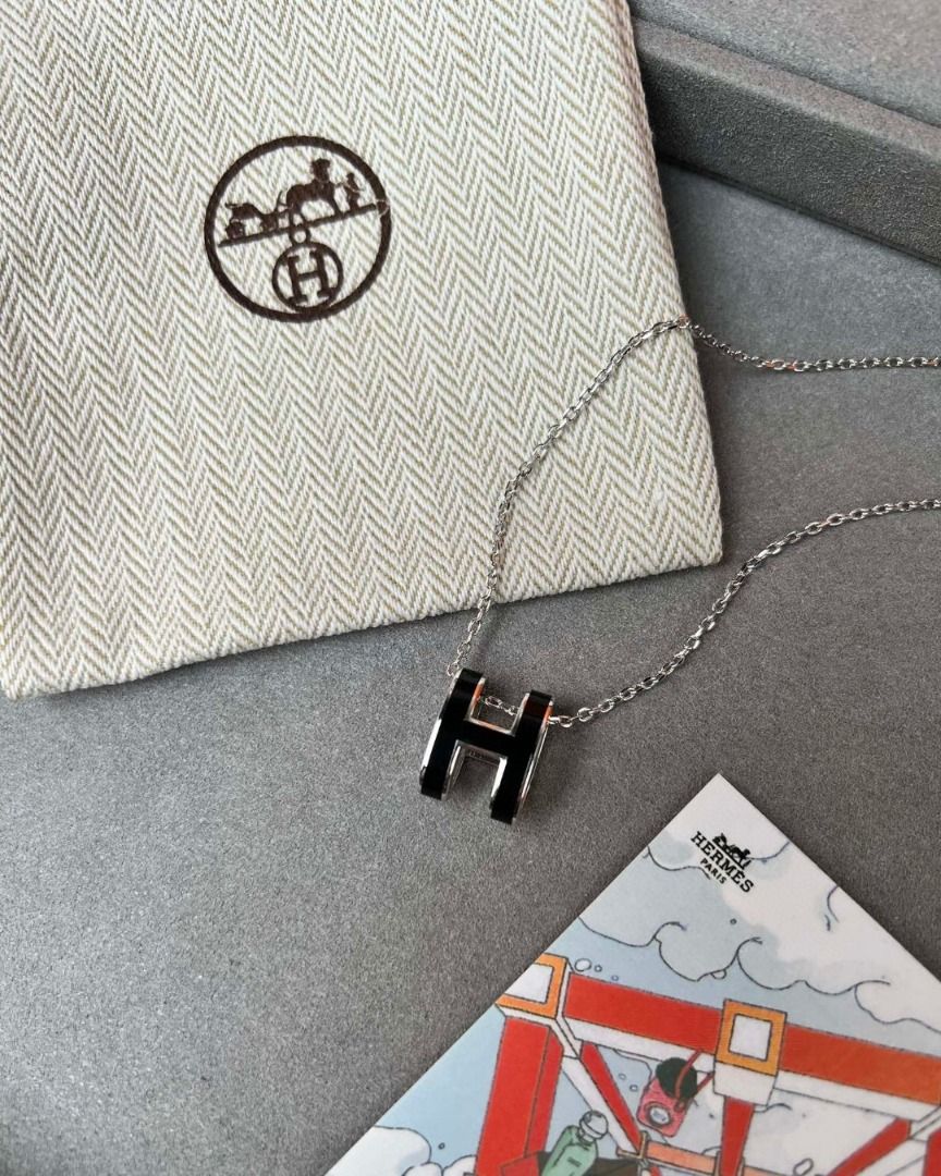 Hermes H Necklace Silver Black (Category: Necklaces) located in San Juan City. Submitted by zenocean-f9dfa7 (Listing ID 1459710090, Image 2). Description: - Authentic outlet Hermes necklace - Iconic 'H' pendant with black enamel - Silver chain - Includes original Hermes box and dust pouch - Versatile for everyday or special occasions - A timeless Hermes classic.