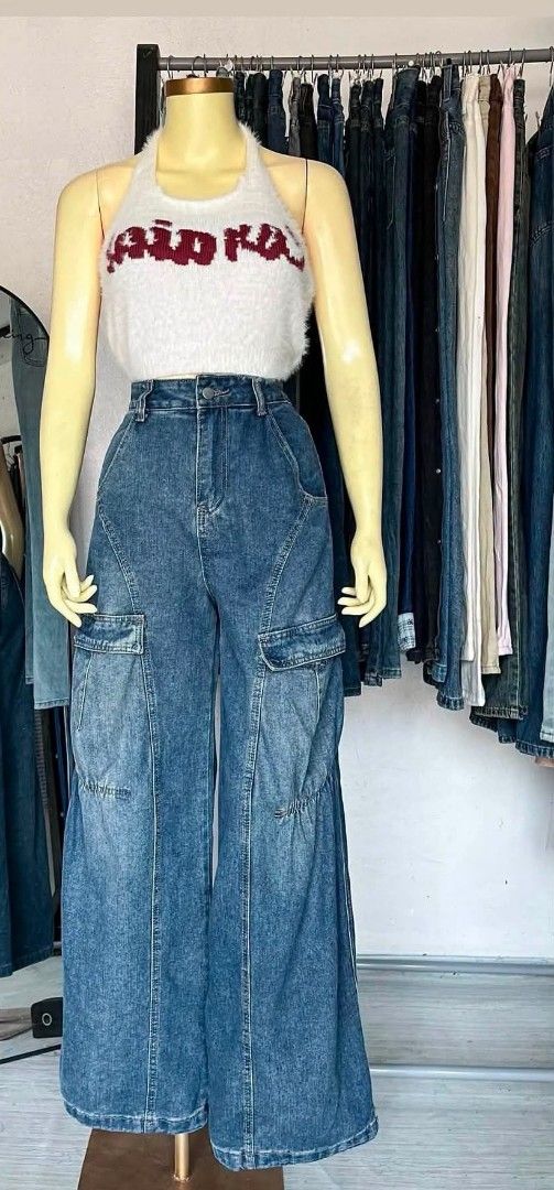 High Waisted Wide Leg Cargo Jeans (Category: Jeans) located in Trece Martires City. Submitted by sh4m. (Listing ID 1459790943, Image 1). Description: Size 27 - Super cool wide leg cargo jeans - High waisted fit with a relaxed silhouette - Plenty of pocket details for a functional cargo look - Classic blue wash denim - Ideal for creating a casual streetwear outfit - Versatile styling: pair with crop tops or fitted tees.