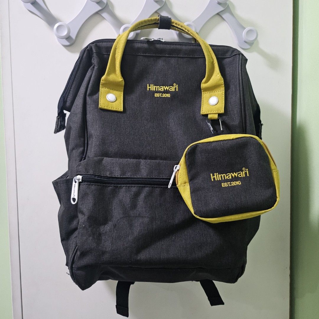 Himawari - Gray with Yellow Accent Backpack with Pouch (Category: Backpacks) located in Quezon City. Submitted by al1en_rob0t (Listing ID 1459788502, Image 1). Description: PRICE: ₱1,250 EACH How to Order: Please message me with the item number you want to purchase or a screenshot of the item. Details: • MOD: LBC, J&T, SDD (shipping fee shouldered by buyer) • MOP: GCash / MariBank.
