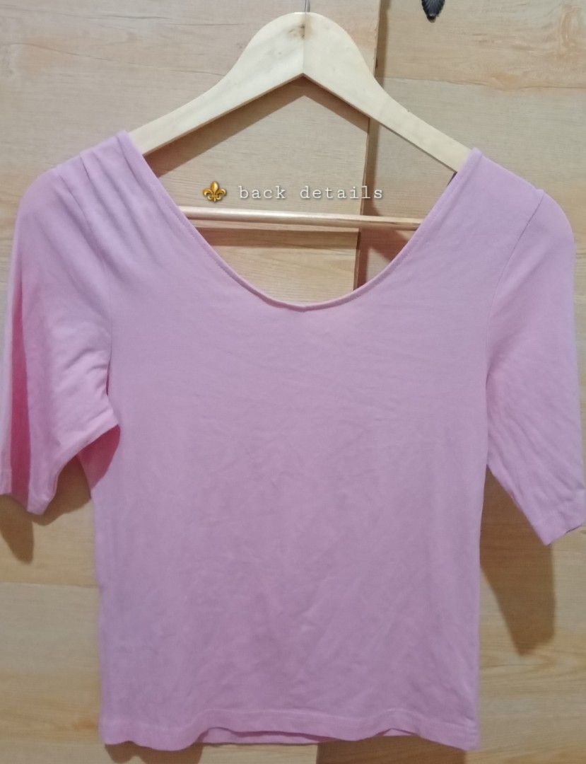 H&M | Divided Basic Pink Cropped Top Shirt ♡ Preloved ♡ (Category: Shirts) located in San Fernando. Submitted by _luxielleph (Listing ID 1459730650, Image 3). Description: ✨️ pls manage expectation on preloved items✨️ - Pink cropped top from H&M Divided - Features a scoop neckline and short sleeves - Stylish V-neck detail on the back - Very small, almost unnoticeable hole near the hem - Ideal for everyday casual wear.