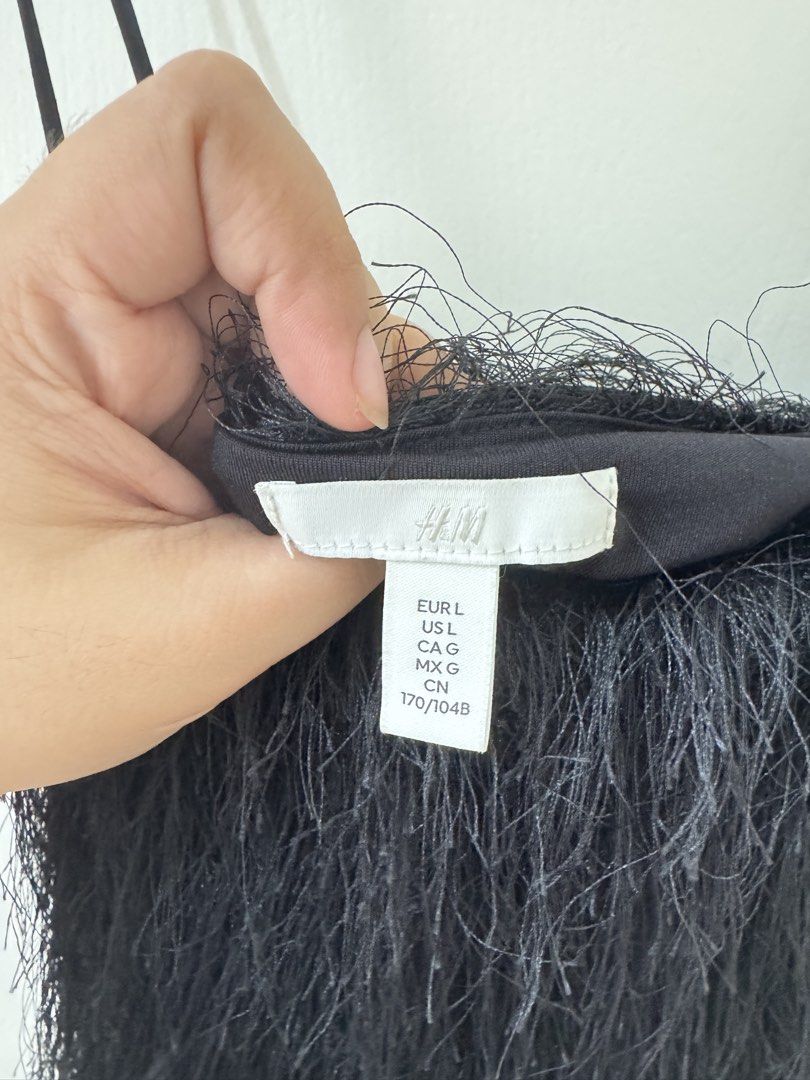 H&M Black Fringed Spaghetti Strap Top Size L (Category: Sleeveless) located in Mandaluyong City. Submitted by trinket.ph (Listing ID 1459734452, Image 2). Description: - Black H&M top - Size: L - Spaghetti straps - Unique fringe detailing - Great for parties or a night out - Versatile: pairs well with jeans or skirts.