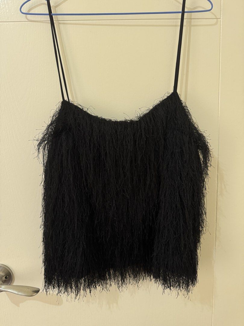 H&M Black Fringed Spaghetti Strap Top Size L (Category: Sleeveless) located in Mandaluyong City. Submitted by trinket.ph (Listing ID 1459734452, Image 1). Description: - Black H&M top - Size: L - Spaghetti straps - Unique fringe detailing - Great for parties or a night out - Versatile: pairs well with jeans or skirts.