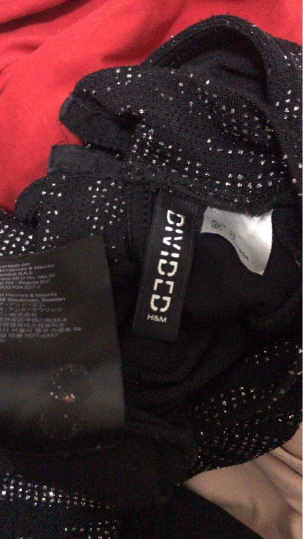 H&M Divided Black Sparkly Long Sleeve Bodysuit (Category: Others Tops) located in Manila. Submitted by airamef28.closet (Listing ID 1459860655, Image 3). Description: - Black long sleeve bodysuit - Sparkly details - High neckline - Low open back - Brand: H&M Divided - Perfect for parties or a night out - Style with jeans or a skirt.