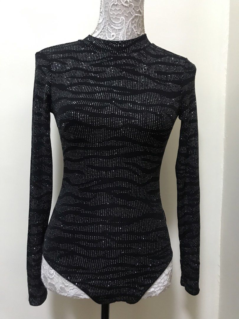 H&M Divided Black Sparkly Long Sleeve Bodysuit (Category: Others Tops) located in Manila. Submitted by airamef28.closet (Listing ID 1459860655, Image 1). Description: - Black long sleeve bodysuit - Sparkly details - High neckline - Low open back - Brand: H&M Divided - Perfect for parties or a night out - Style with jeans or a skirt.