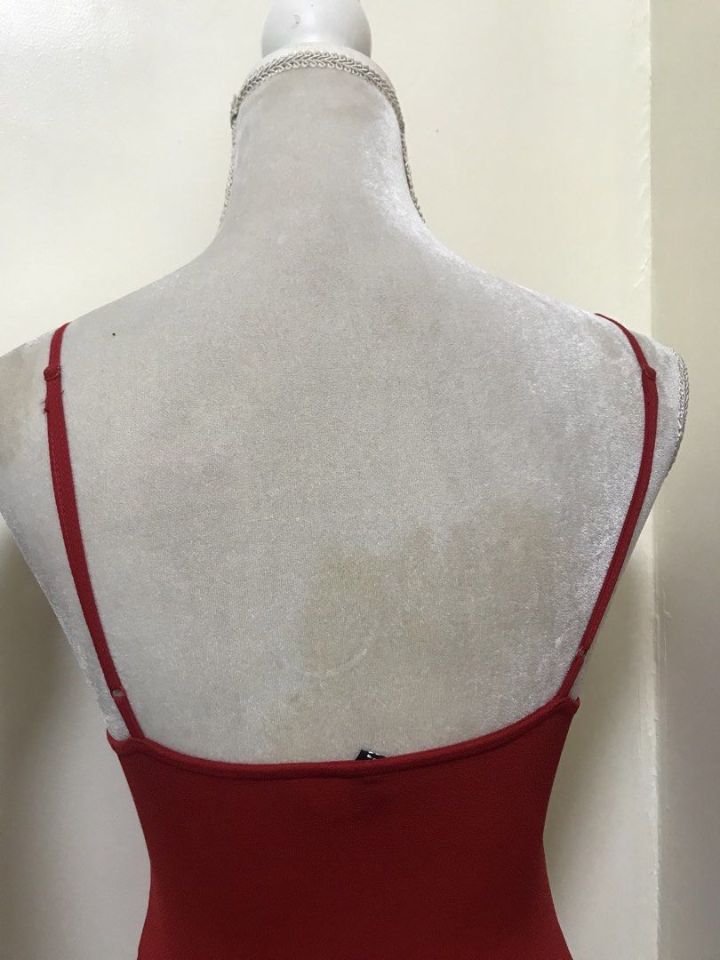 H&M Divided Red Knot Front Cutout Bodysuit (Category: Others Tops) located in Manila. Submitted by airamef28.closet (Listing ID 1459857966, Image 2). Description: - Red H&M Divided bodysuit - Knot front detail with a cutout - Thin spaghetti straps - Stretchy and comfortable material - Versatile: perfect for layering, nights out, or beach days.