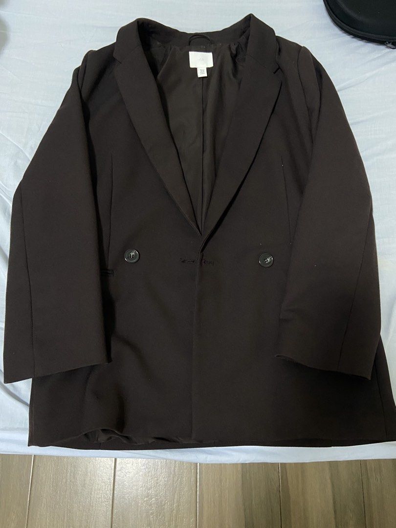H&M Double-Breasted Blazer XS Dark Brown (Category: Coats, Jackets and Outerwear) located in Balanga. Submitted by d1038381 (Listing ID 1459832927, Image 1). Description: - Brand: H&M - Color: Dark Brown - Style: Double-breasted with 2 buttons - Size: XS - Material: Polyester and Viscose blend - Versatility: Perfect for dressing up or down.