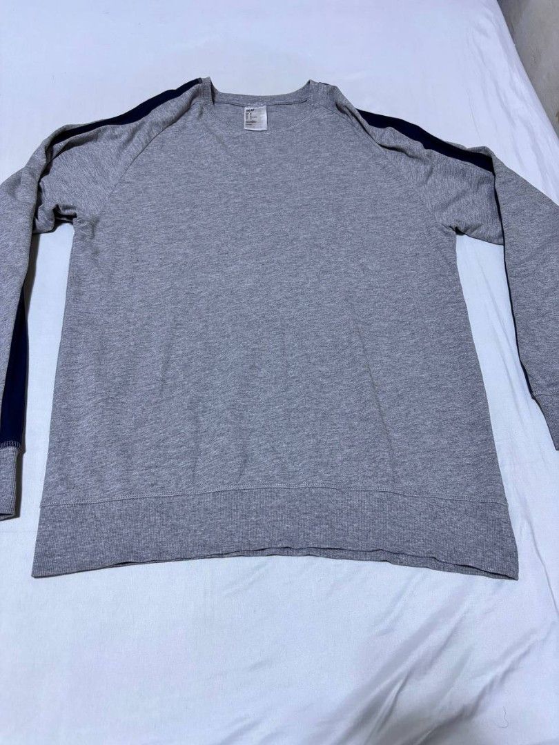 H&M Grey Sweatshirt with Navy Stripes (Category: Coats, Jackets and Outerwear) located in Pasig City. Submitted by heneralsupremo1892 (Listing ID 1459706779, Image 1). Description: - H&M Grey Long-Sleeved Sweatshirt - Features navy blue stripes on sleeves and shoulders - Ribbed cuffs and hem for a snug fit - Comfortable and casual design - Perfect for everyday wear - Authentic and Legit❗ - Very Good Condition/ Almost New 🔥 - Size: M to L🫶 - No 