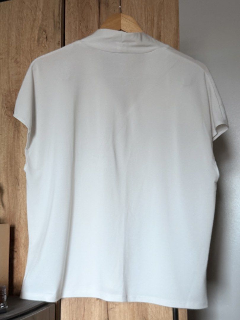 H&M Sheer Blouse (Category: Blouses) located in Mandaluyong City. Submitted by kat.declutters (Listing ID 1459724455, Image 2). Description: H&M sheer white blouse Large 25” L x 23” W Used condition Stain on front lower part, sewed the V-neck for a more conservative look Rfs: decluttering.