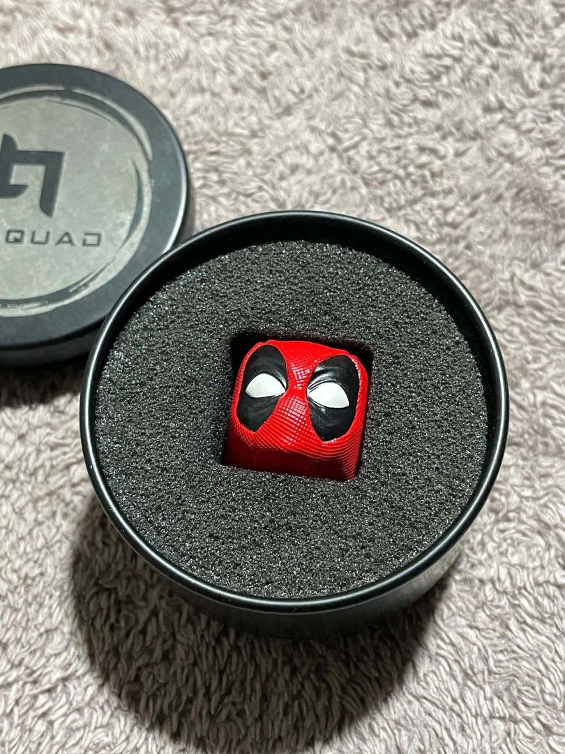 Hobqad Deadpool Artisan Keycap (Category: Computer Keyboard) located in Pasay City. Submitted by nagumeow (Listing ID 1459862761, Image 2). Description: - Unique Deadpool artisan keycap - Compatible with mechanical keyboards - Includes original tin packaging - Ideal gift for Deadpool fans and keyboard enthusiasts.