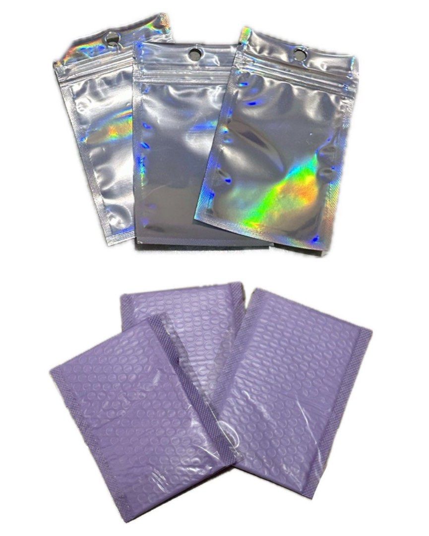 Holographic & Purple Bubble Mailer Pouches (Category: Craft Supplies & Tools) located in Manila. Submitted by kksantos0220983 (Listing ID 1459719346, Image 1). Description: - Bundle includes holographic zip pouches and purple padded bubble mailers. - Holographic pouches feature a zip closure and a top hole for hanging. - Purple bubble mailers offer padded protection for your items. - Ideal for shipping small goods or organizing jewelry..