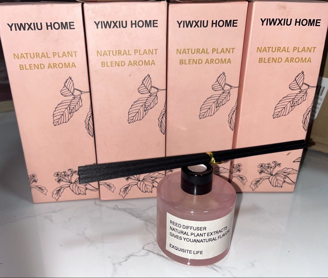 HOME Natural Plant Blend Aroma Reed Diffuser (Category: Home Fragrance) located in Paranaque City. Submitted by sissyloveph (Listing ID 1459710026, Image 1). Description: - YIWXIU HOME Reed Diffuser - Natural plant blend aroma - Perfect for home fragrance - Includes diffuser sticks - Stylish pink bottle with 'Reed Diffuser, Natural Plant Extracts, Gives You a Natural Flavor, Exquisite Life' label - Comes with original box.