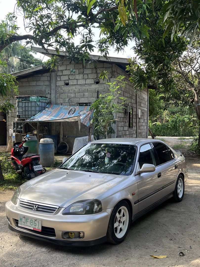 Honda Civic 1.6 VTI (A) (Category: Used Cars) located in Makati City. Submitted by warm.abc123 (Listing ID 1459695877, Image 2). Description: 2000 Honda Civic SIR BODY Loc: San Antonio, Quezon province (near Lipa Batangas) Automatic transmission (no delay) All stock P6FD6 VTEC engine all stock Good running condition Okay pa paint wag lang sobra selan sidemirror working Stock interior Raybrig foglight Te37 Grid1 mags Adjustable coilsleeve New adju