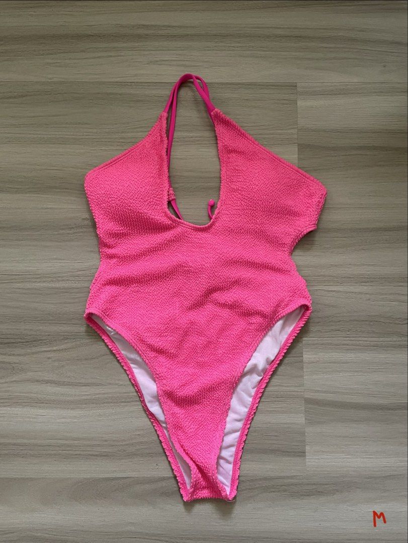 Hot Pink Textured One-Piece Swimsuit (Category: Bikinis & Swimsuits) located in Manila. Submitted by possiblymaybe.717 (Listing ID 1459782459, Image 1). Description: - Bright hot pink one-piece swimsuit - Textured fabric all over - Halter neck with tie-back - High-cut leg design - Ideal for beach or pool - Perfect for summer vibes.