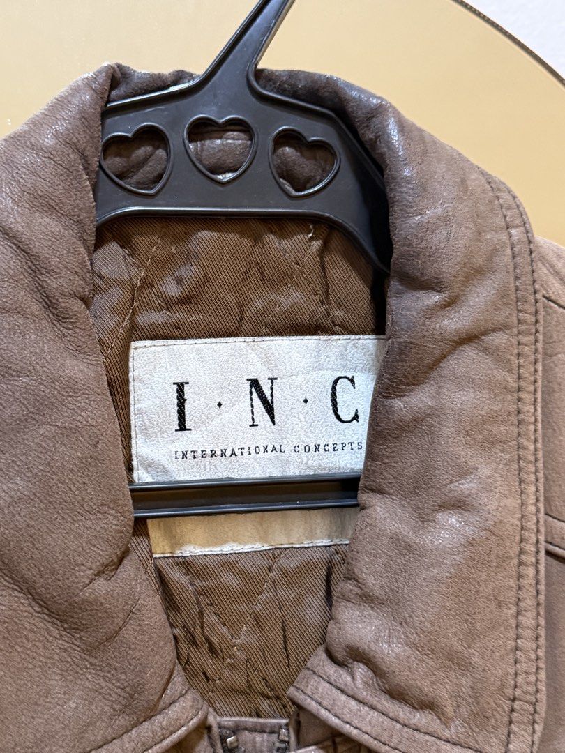INC International Concepts Brown Leather Bomber Jacket (Category: Coats, Jackets and Outerwear) located in Makati City. Submitted by nemkd (Listing ID 1459724385, Image 2). Description: - Classic brown leather bomber jacket - Brand: INC International Concepts - Quilted lining for warmth - Two front pockets with button closures - Zipper front closure - Ideal for cooler weather - Timeless wardrobe staple.