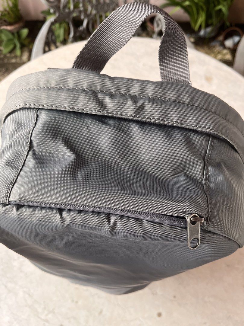 Incase Grey Medium Backpack (Category: Backpacks) located in Las Pinas. Submitted by pastel_rewind_ph (Listing ID 1459713642, Image 3). Description: Incase Grey Backpack (medium to semi-large size) - Nylon Polyester-Canvas External Fabric - 2 open pockets on the sides, 1 zipper front pocket and 1 small zipper top pocket for phone and small valuables. - Zipper Main Compartment, 4 open pockets inside and a padded laptop sleeve compartment fits 14 i