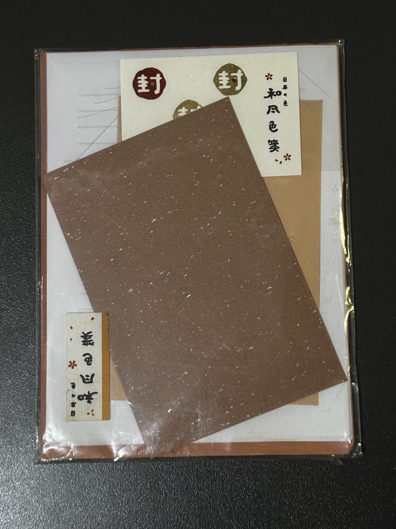 Japanese Letter Set (Category: Stationery & School Supplies) located in Manila. Submitted by sharksfin06 (Listing ID 1459743012, Image 1). Description: - Adorable Japanese stationery set - Includes washi paper - Features stickers with '封' (seal) and floral designs - Comes with a small card featuring Japanese text - Ideal for journaling, scrapbooking, and decorating letters - All items are brand new and sealed in plastic packaging.