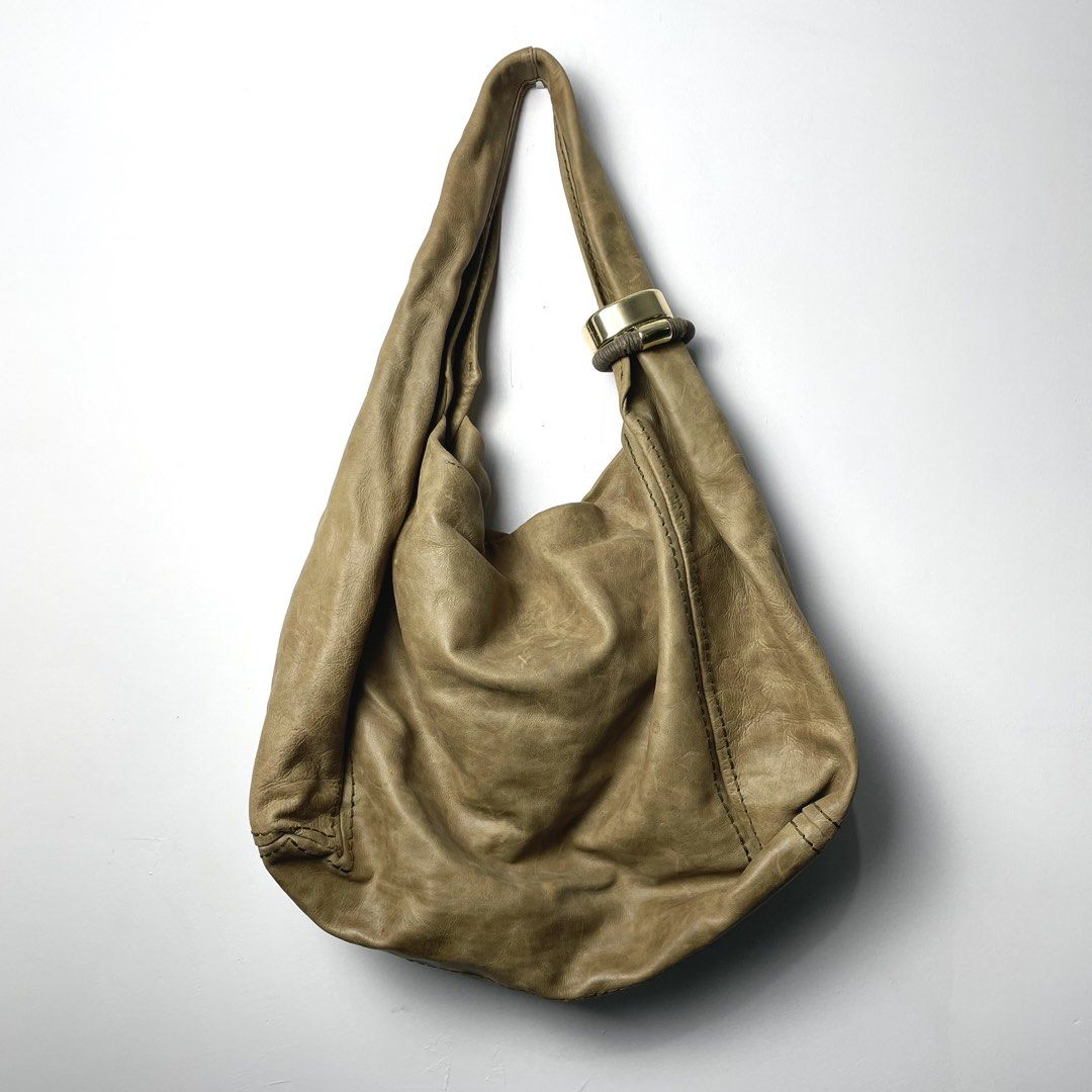 Jimmy Choo Tan Leather Saba Hobo Bag (Category: Shoulder Bags) located in Baguio. Submitted by metro_studio (Listing ID 1459716352, Image 3). Description: Authentic Tan leather, Gold hardware, Slouchy design, Spacious interior (will fit laptop and more) In Great Condition.