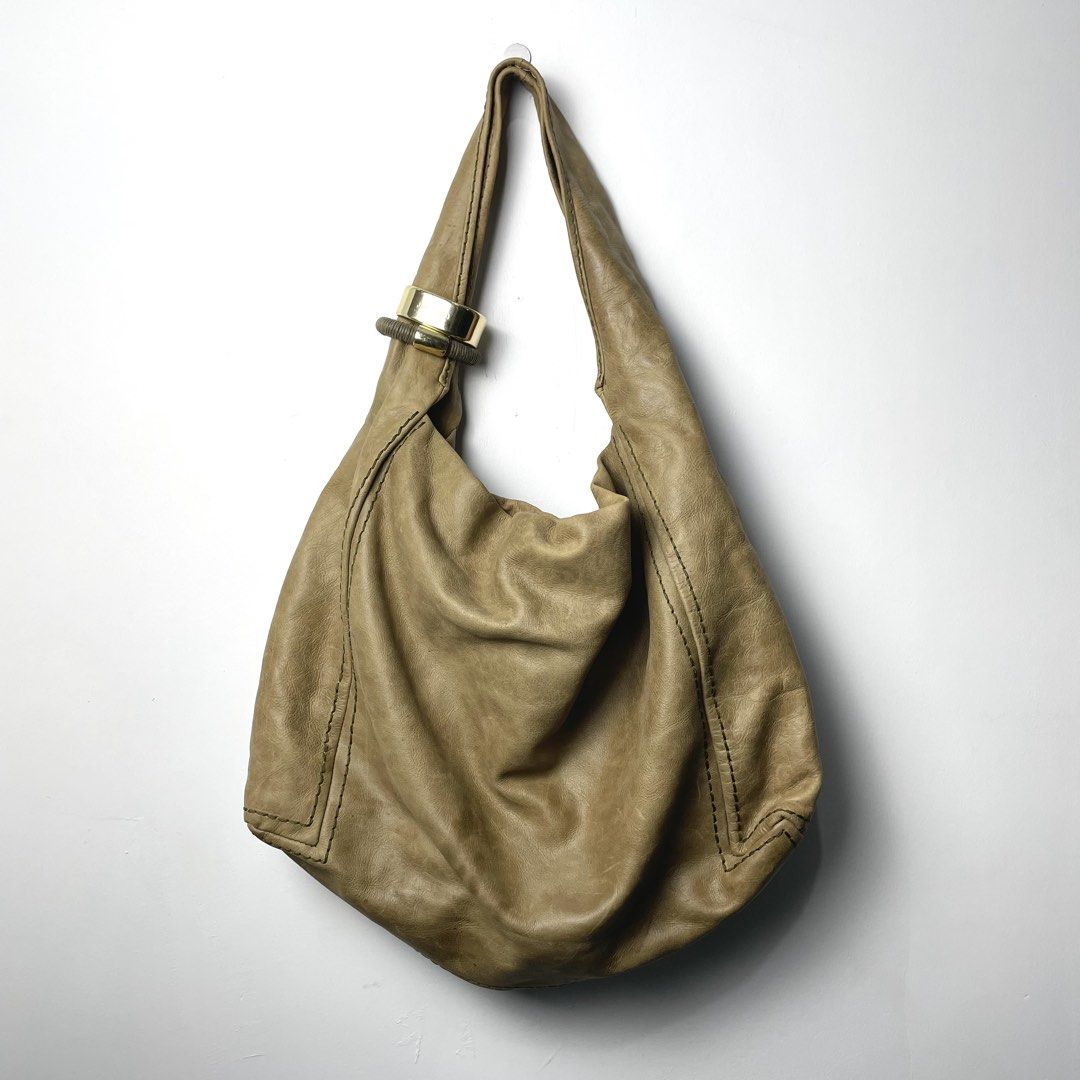 Jimmy Choo Tan Leather Saba Hobo Bag (Category: Shoulder Bags) located in Baguio. Submitted by metro_studio (Listing ID 1459716352, Image 2). Description: Authentic Tan leather, Gold hardware, Slouchy design, Spacious interior (will fit laptop and more) In Great Condition.