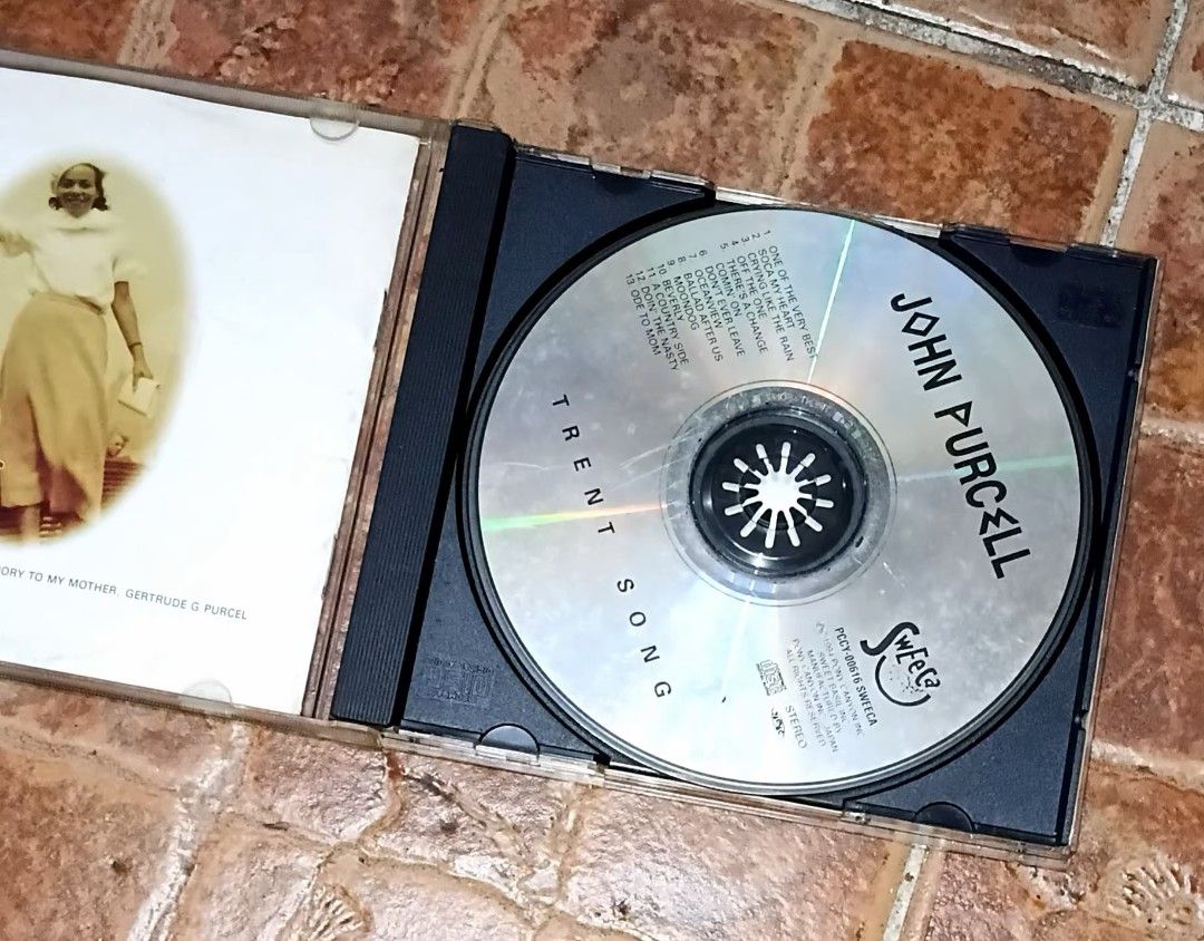 John Purcell Trent Song CD (Category: CDs & DVDs) located in Quezon City. Submitted by dancatz (Listing ID 1459776553, Image 2). Description: □ P 100.00 - John Purcell Trent Song CD - Features 12 tracks - Includes hit songs like 'One of the Very Best' and 'Soca My Heart' - Comes with a booklet containing lyrics and photos - CD case shows some signs of wear - A must-have for any music collector! LFB Seller's location : Brgy. Sta. Teresita Quezon C
