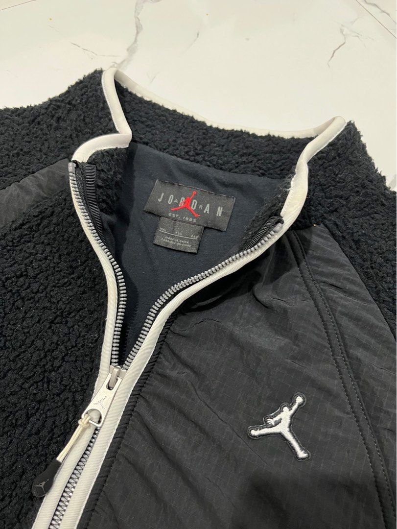 Jordan Fleece Zip-Up Jacket Black (Category: Coats, Jackets and Outerwear) located in Manila. Submitted by obedmagall74424 (Listing ID 1459848004, Image 3). Description: - Black Jordan fleece jacket - Size XXL - Made from soft faux fur - Full zip closure with white trim - Iconic Jumpman logo on the chest - Perfect for staying warm and stylish - Size Xxl 27x25.5 Excellent to new condition No issue 1250+ship.