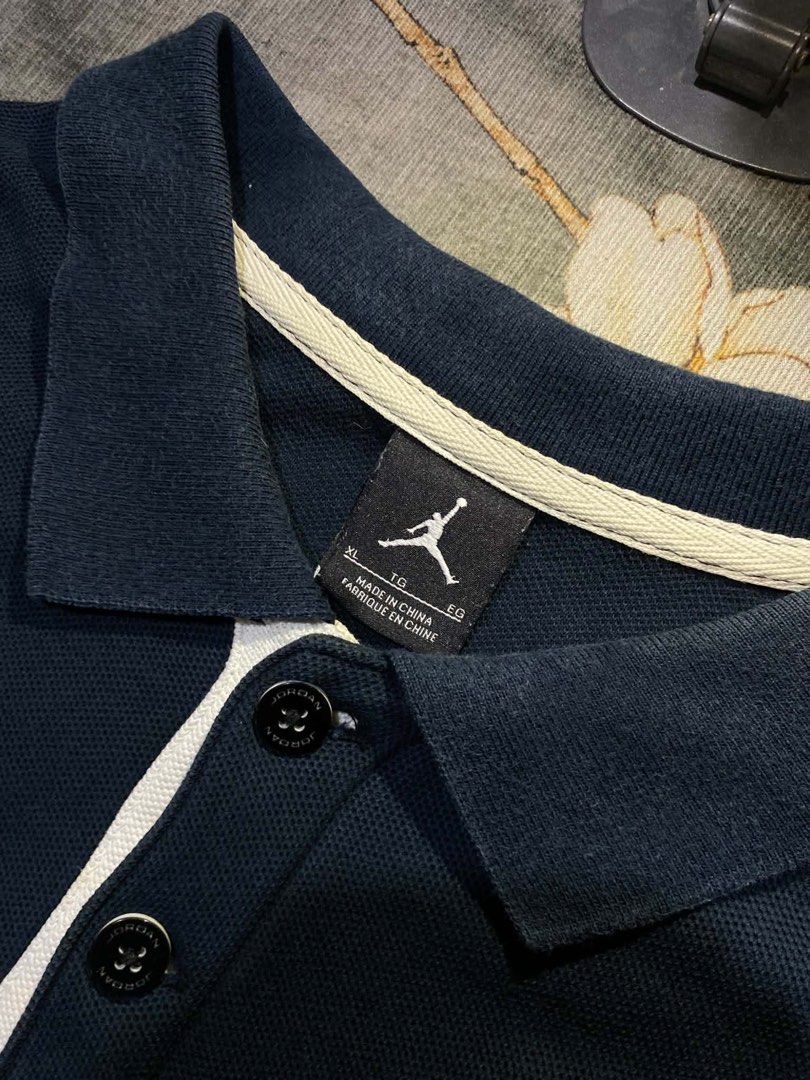 Jordan Polo (Category: Tshirts & Polo Shirts ) located in Caloocan City. Submitted by kardoyredb54515 (Listing ID 1459708514, Image 2). Description: - Navy blue Jordan polo shirt - Features embroidered Jordan logo on the sleeve - Small Jordan tag detail on the cuff - Classic polo collar design - Ideal for casual everyday wear.